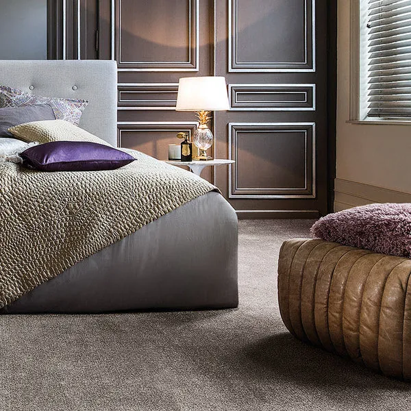 Neutral-carpet-in-modern-bedroom-with-dark-wood-paneling