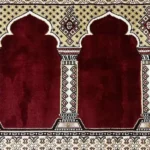 red mosque carpet in Dubai with traditional Mihrab patterns for masjid prayer halls and Islamic centers.